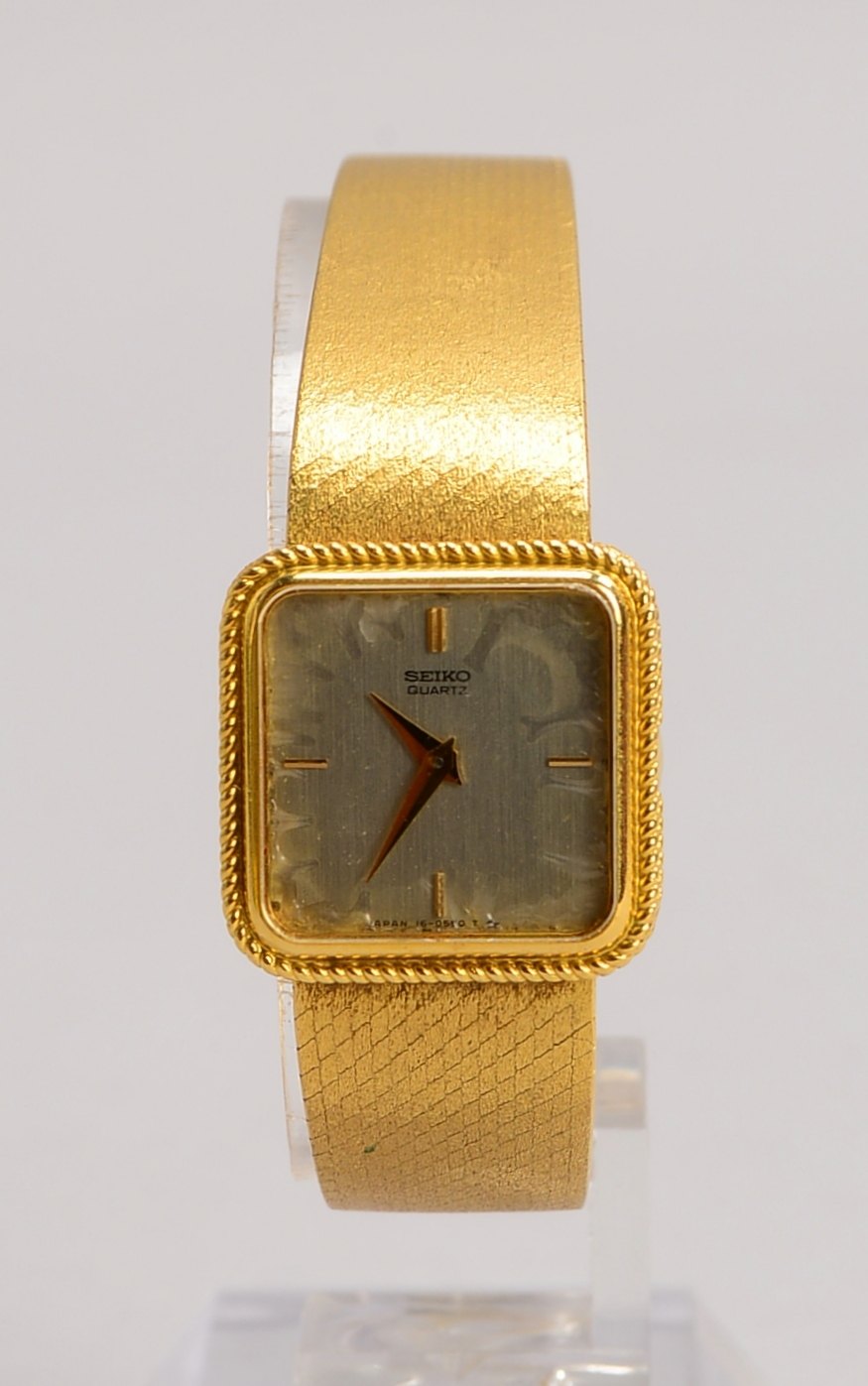 DAU Seiko, Quarz, 750 GG-Geh./Armband, quadrat., Strichindizes; Gew. 47,70 g