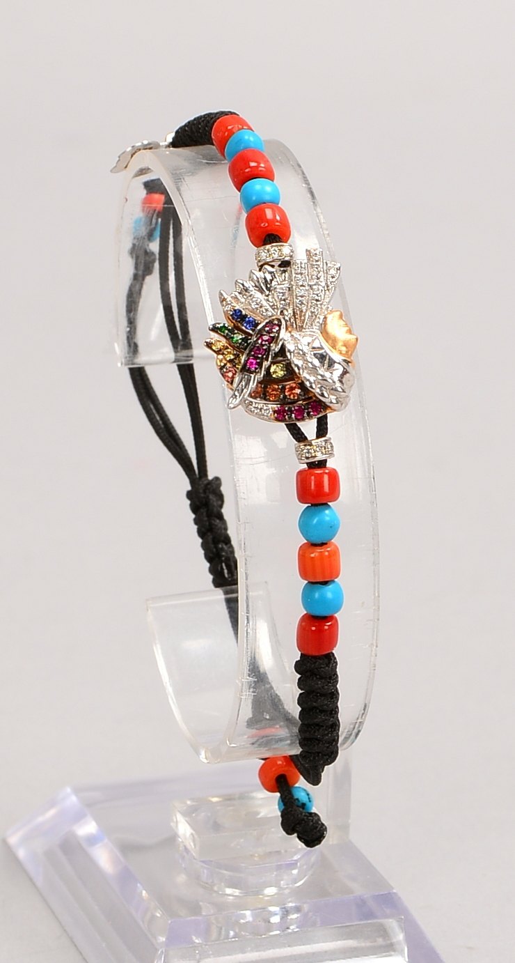Pippo Perez-Armband, 'Indianer', 750 WG (gest.), mit vielf. Steinbes., an Kordelarmb.