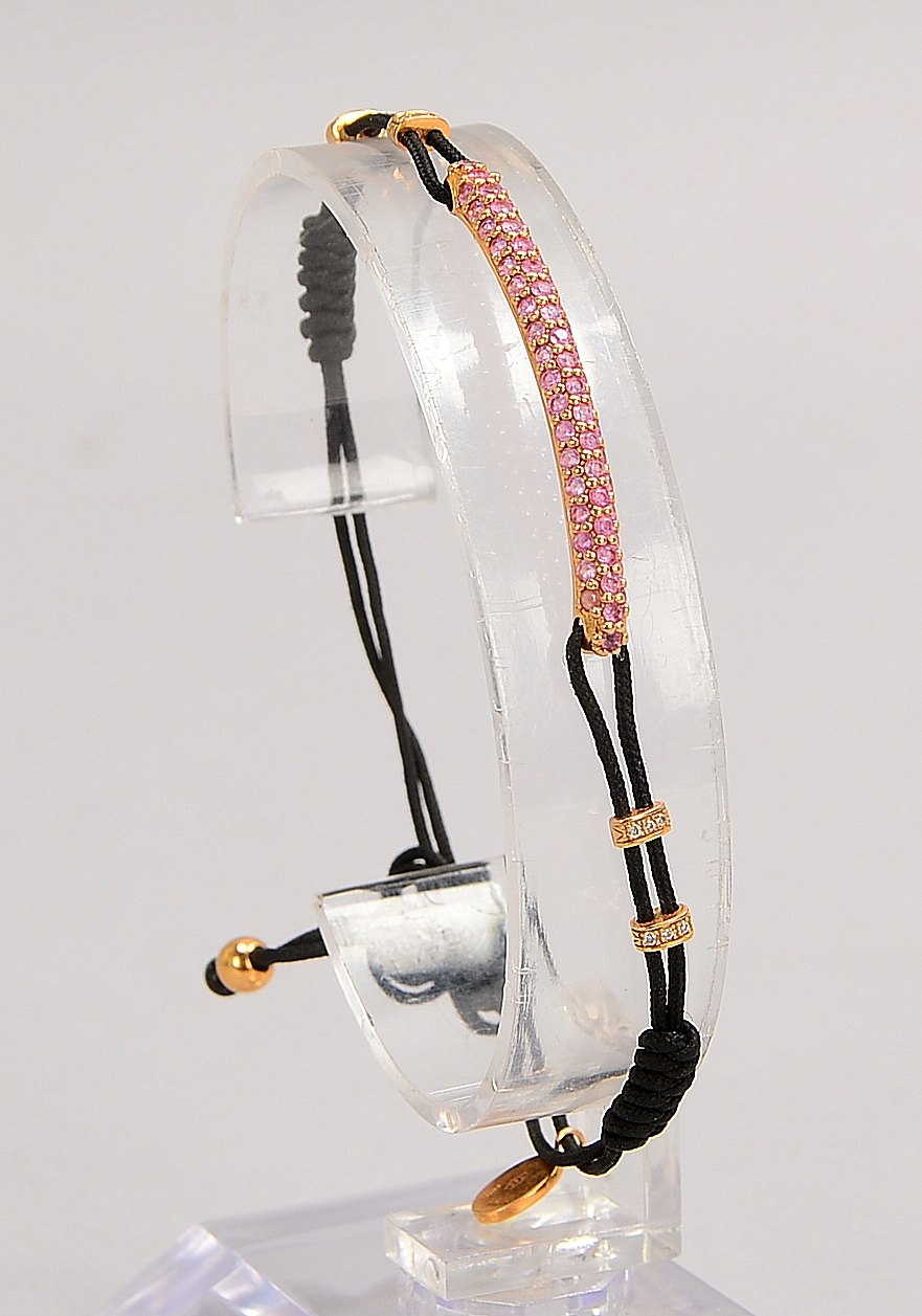 Pippo Perez-Armband, 'Strang', 750 RG (gest.), mit vielf. Saphirbes., an Kordelarmb.