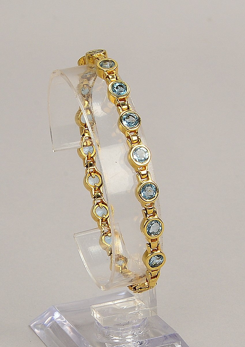 Armband, 585 GG (gest.), mit 16-fachem Blautopas-Besatz, mit Karabinerschließe