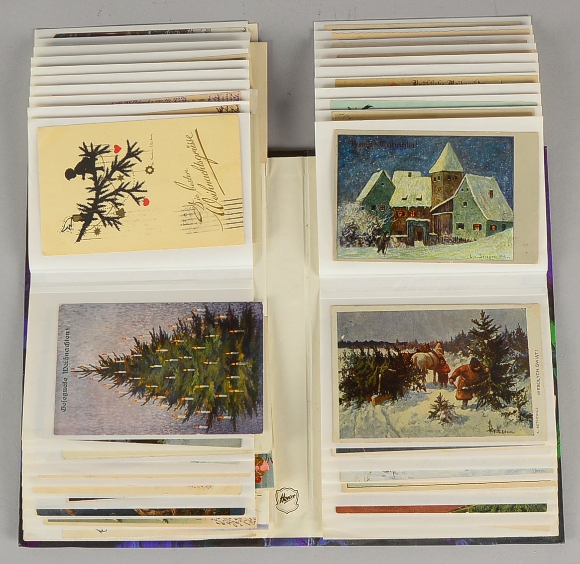 Postkarten (ab I. WK), 'Weihnachtsmotive', 74 Stück - im Album gesammelt