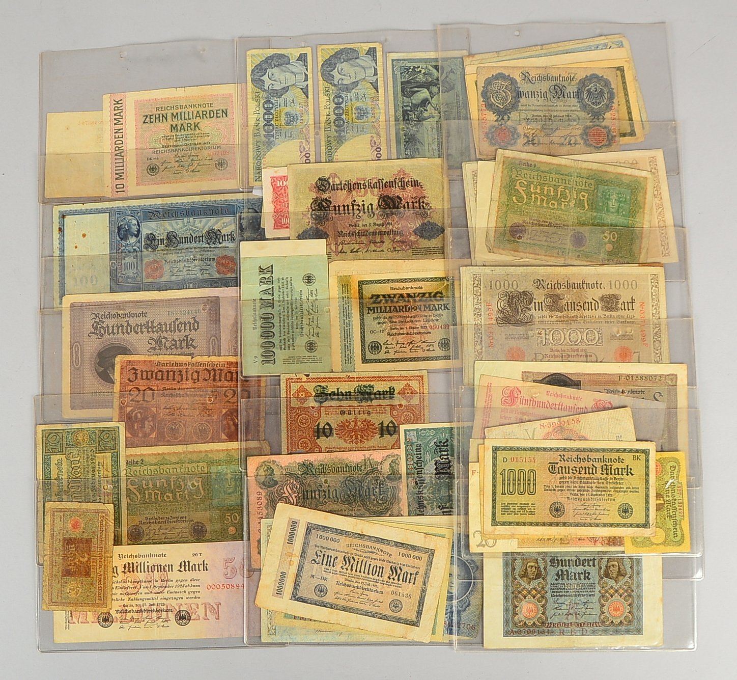 Banknoten: '100', '1.000', '20.000', '1 Mio. Reichsmark'; 1x 'Reichsbahn - 20 Mio.'