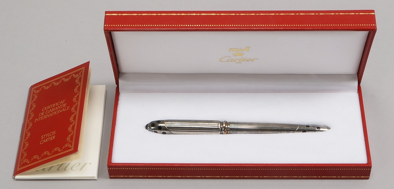 Cartier-Drehkugelschreiber, 'Le Must de Cartier', 'Stylo Panthère', silberfarb. Gehäuse
