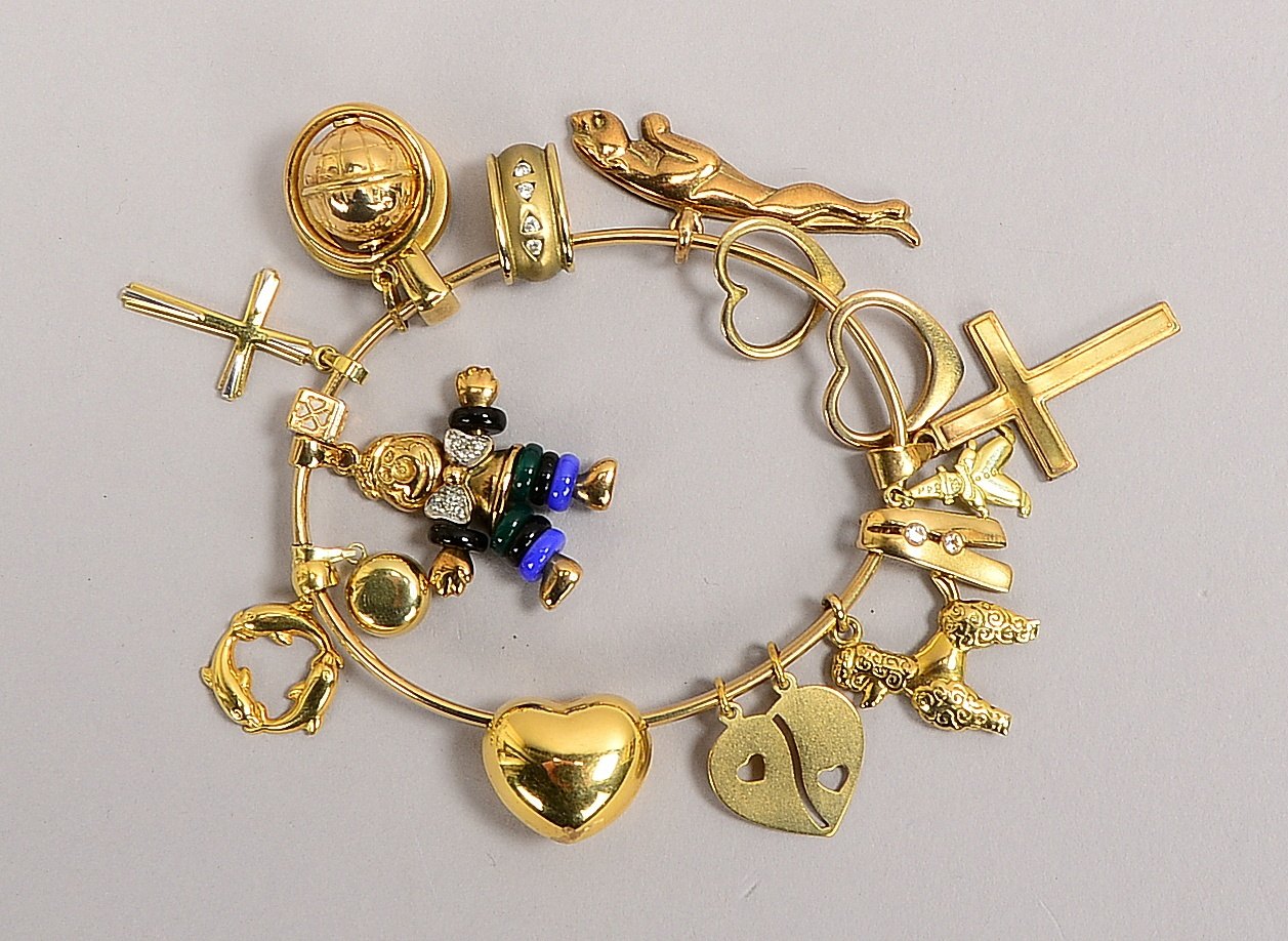 Bettelarmreif, 333 GG (gest.), figürl. Charms/Anh., versch. Goldgehalte, teils Steinbesatz