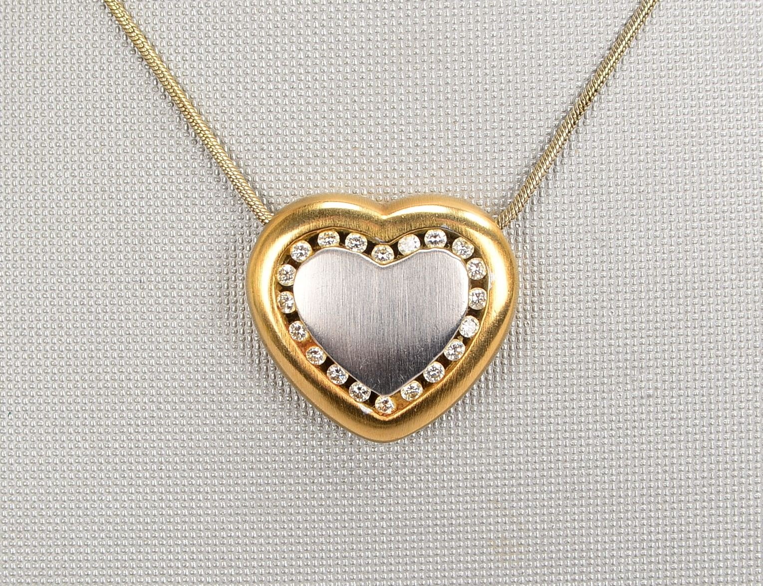 Collier, 585 WG/GG (gest.), Herzanh. mit 20x kl. Diam./ca. 0,20 ct; Gewicht 13,40 g
