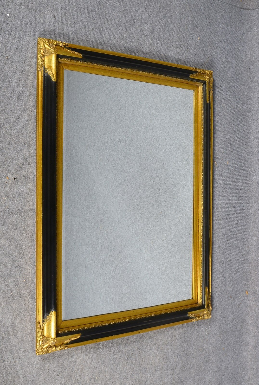 Wandspiegel, fac. Glas, Holzrahmen teils verg./teils schwarz gebeizt; RM 108 x 78 cm