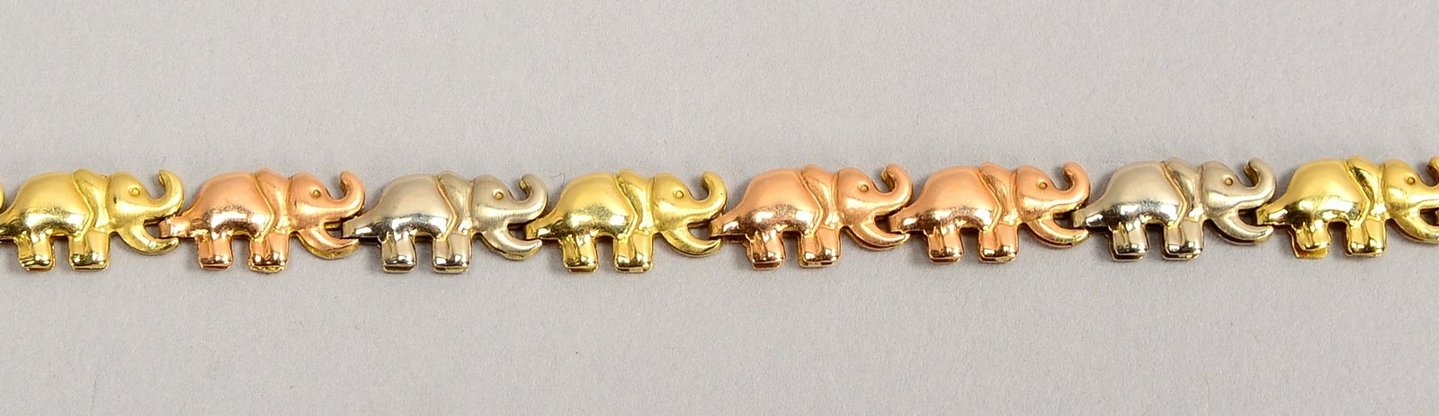 Armband, 585 Gold/tricolor (gestempelt), umlaufend mit figürlichen Gliedern, 'Elefantenreigen'; Läng
