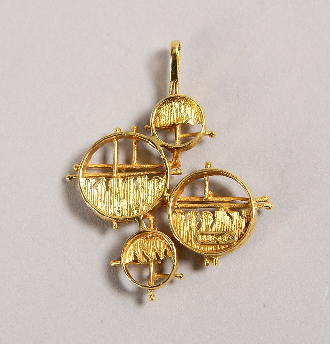 Anhänger, 585 GG (gest.), abstr./4x ringf. Elemente; Länge 4 cm, Gewicht 6 g