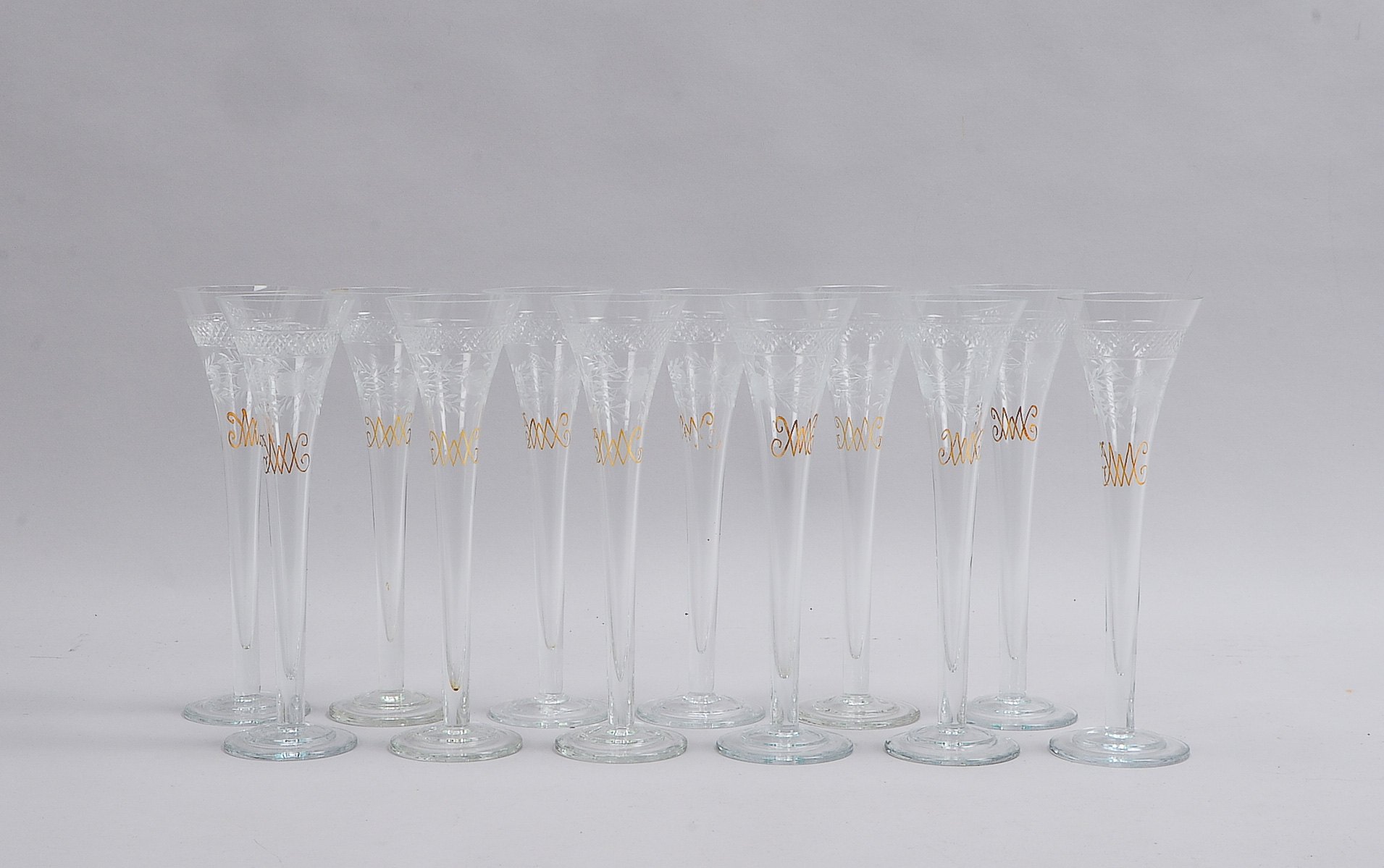 WMF, Satz Sektflöten, 'Fürst von Metternich', mit Schliffdekor, goldstaffiert, 12 Stück; Höhe 23 cm