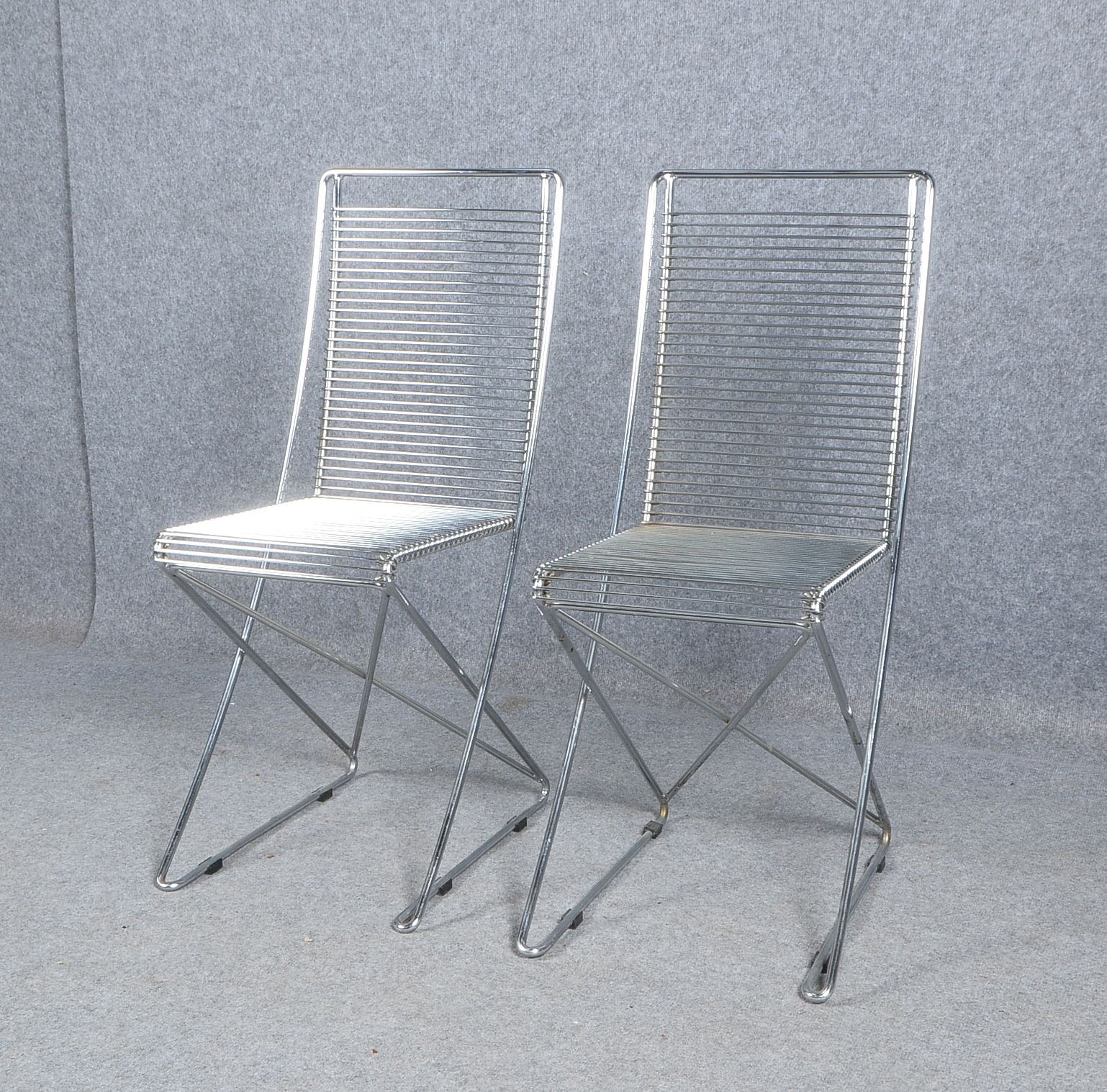 Schlubach, Paar Designer-Kreuzschwinger, Gestell verchromter Stahl, Entwurf: Till Behrens (1983); Le