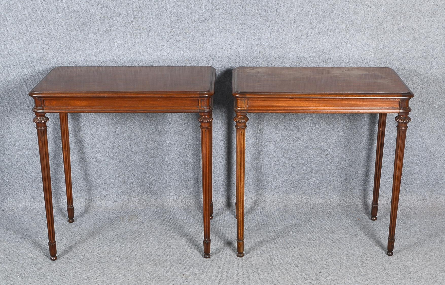 2 Beistelltische, Mahagoni, gemarkt: Liberty London, Gebrauchsspuren; Maße 77 x 75 x 46 cm