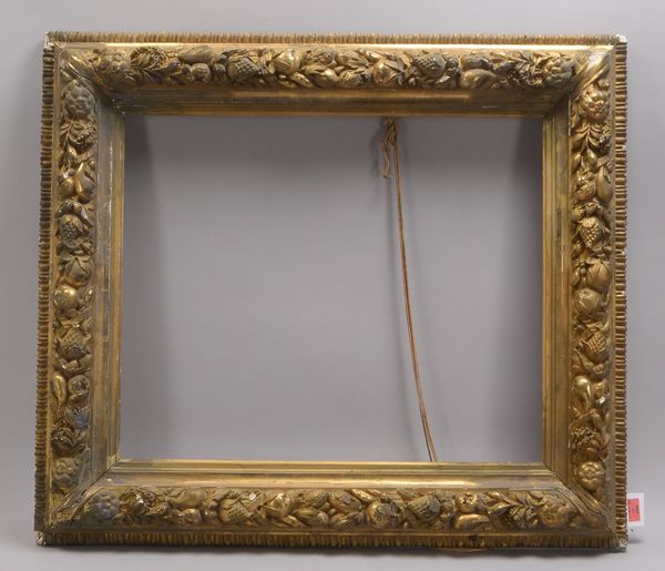 Prunkrahmen, Stuck und Holz, mit figürlichem Reliefdekor (Früchtemotive); Falzmaße 74 x 61,5 cm