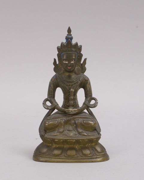 Bronzeskulptur (Tibet), 'Sitzender Buddha', Hohlguss-Figur auf Lotussockel; Höhe 17 cm