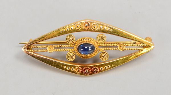 Brosche, 585 GG (gest.), mit Saphircabochon; Länge 3,8 cm, Gewicht 2,60 g