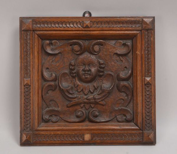 Holzrelief/Kassette, Eiche, 'Putto-Kopf', gerahmt; Rahmenmaße 35 x 37 cm