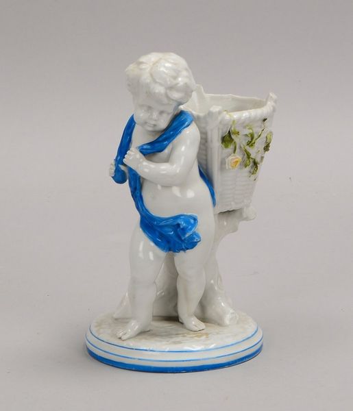 Porz.-Figur, 'Knabe mit Blumenkorb', teils blau staffiert; Höhe 18 cm (1x 'Blume' fehlt)