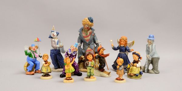 12 Porz.-Figuren: 7x Hummel/Goebel, und 5x 'Clowns' (versch. Manufakturen)