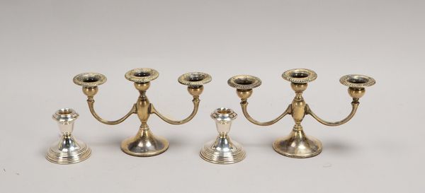 4 Kerzenleuchter, 925 Sterlingsilber: 2x 3-fl., Höhe 13,5 cm; 2x 1-fl. (gefüllt), Höhe 8 cm
