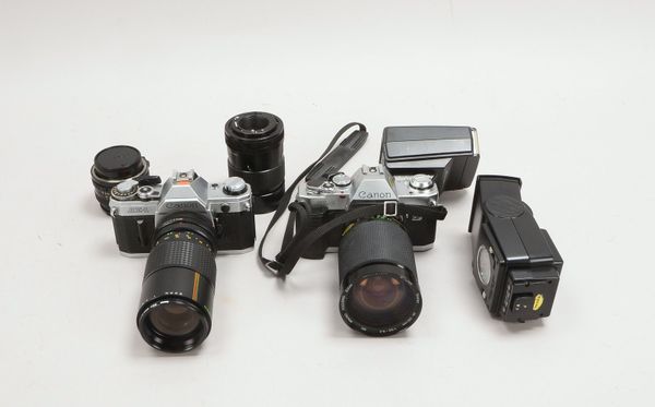 Fotogr-Konvolut: 2 Canon-Kameras, Mod. 'AE-1' und 'AL-1', mit 4x Obj., im Alukoffer