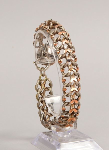 Armband, Silber/partiell vergoldet (punz.), mit Anh. in Kugelform; Gew. 22 g
