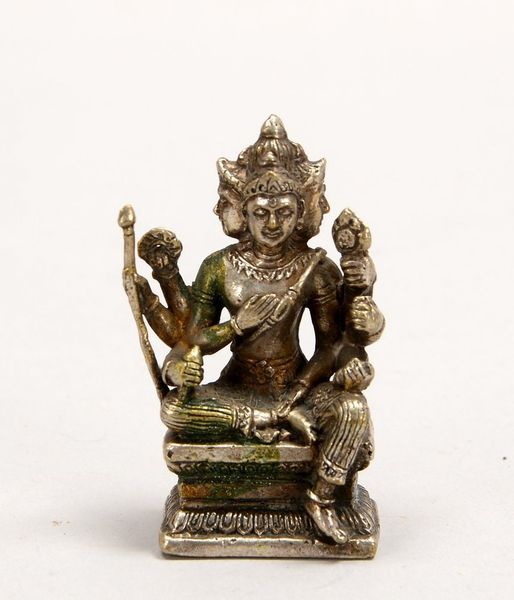 Kl. Bronzefigur (Nepal), 'Reise-Buddha' - 4-köpfige Figur mit Hand-Attributen, versilbert