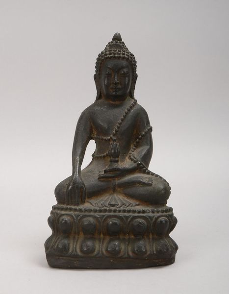 Bronzeskulptur (Burma), 'Sitzender Buddha', schw. patin., Hohlguss mit Bodenabd.