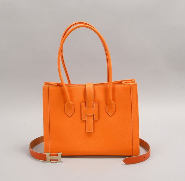 Designer-Handtasche ('H'/Italien), orangef. gepr. Leder, neuw.; und Gürtel, Länge 90 cm
