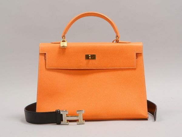 Designer-Handtasche ('H'/Italien), orangef. gepr. Leder, neuw.; und Gürtel, Länge 80 cm