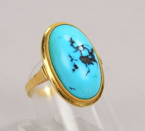 Ring, 585 GG (gest.), mit Malachit-Cabochon; RG 51, Gewicht 5,10 g