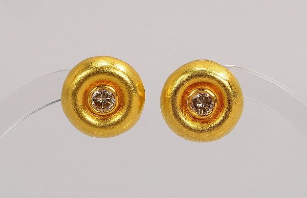 Paar Ohrstecker, 900 GG (gest.), jeweils mit Brill./ca. 0,20 ct; Ø 1,20 cm, Gew. 7,10 g