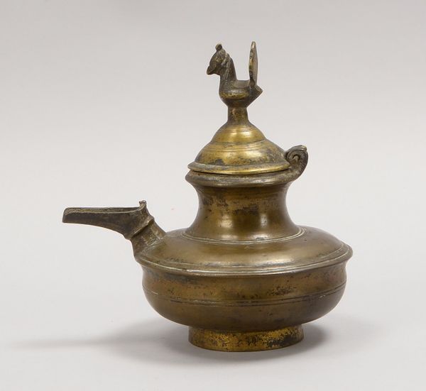 Öllampe, Bronze, scharnierter Deckel mit figürl. Knauf (Vogelfigur); Höhe 17 cm