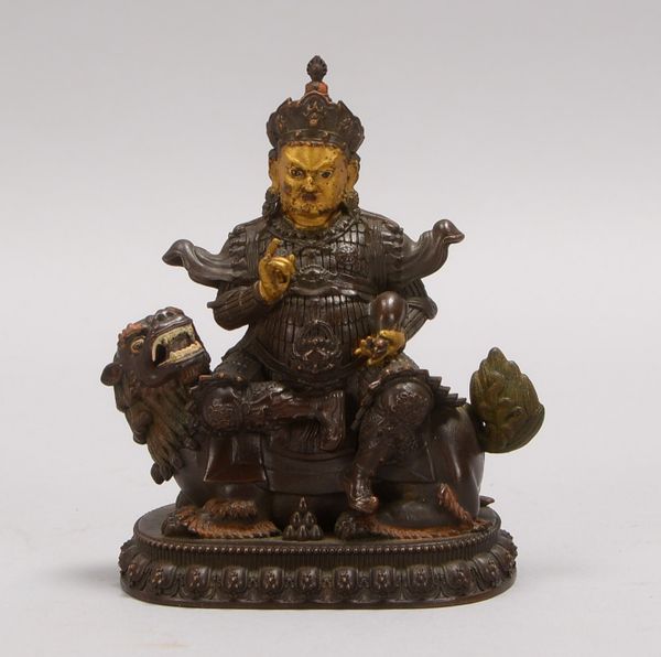 Bronze, Sitzender Buddha/Fu-Hund, partiell farbig gef., Hohlguss; Höhe 11 cm