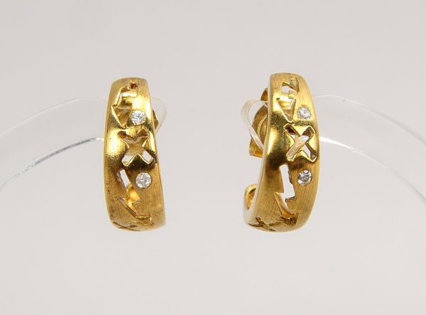Paar Ohrstecker, 333 GG (gestempelt), jeweils mit 2-fachem Zirkonbesatz(?); Gewicht 2,60 g